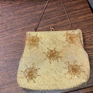 Exquisite vintage gold beaded evening bag with strap.